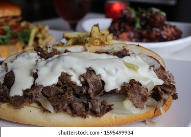 Close Up Of Philadelphia Cheese Steak With French Fries