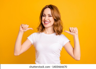 Close up photo amazing beautiful she her lady thumbs indicate direct chest self-confident toothy I am best choice choose pick select me advice wear casual white t-shirt isolated yellow background