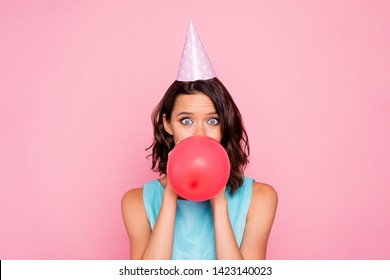 Close up photo amazing beautiful she her lady attractive appearance birthday cap head hide half face big red balloon blowing air staring wear shiny colorful blue dress isolated pink bright background
