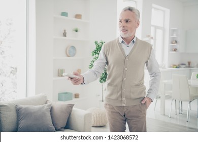 Close Up Photo Amazing He Him His Aged Man Arms Hands Behind Head Console Change Mode System Turn On Cooling Regime Wear White Shirt Waistcoat Pants Comfy Bright Flat House Living Room Indoors