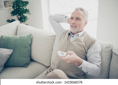 Close Up Photo Amazing He Him His Aged Man Arms Hands Behind Head Console Change Mode System Turn On Cooling Regime Wear White Shirt Waistcoat Pants Sit Comfy Bright Flat House Living Room Indoors