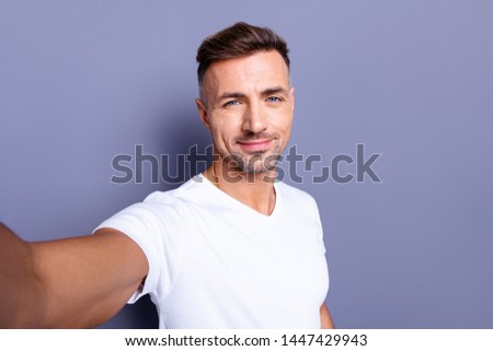 Similar – Image, Stock Photo Portrait of stylish handsome young man with coat standing outdoors and leaning on wall.