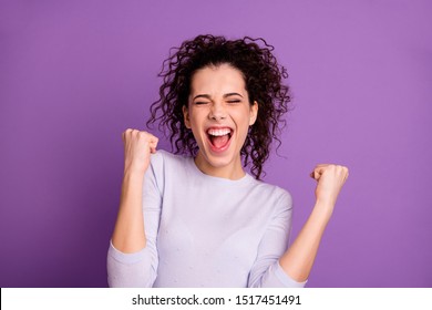 Close up photo of amazing wavy lady win competition yelling raising fists celebrating wear casual pullover isolated purple color background