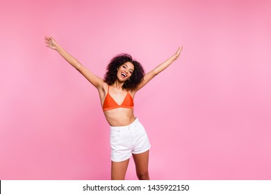 Close up photo attractive beautiful she her dark skin bright lady stylish trendy funky see friends amazed crazy overjoyed girlish fit wear swimming orange suit white shorts isolated pink background