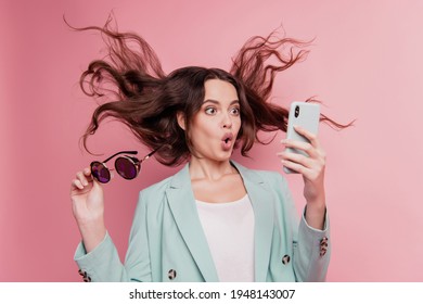 Close up photo of attractive shocked crazy girl typing sms smartphone take off specs - Shutterstock ID 1948143007
