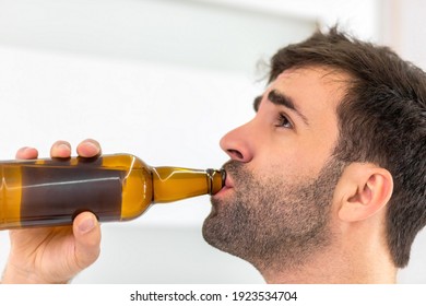 Close Up Photo Of Bearded Man Drinking Cool Beer.