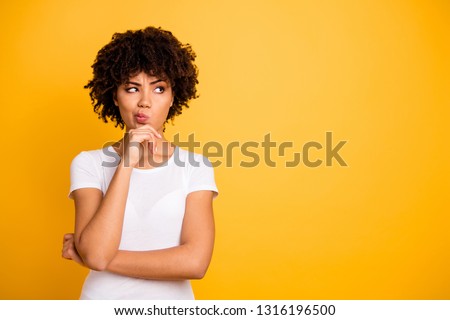 Close up photo beautiful amazed she her dark skin lady arms hands chin think over not sure homework diligent student look empty space wearing casual white t-shirt isolated yellow bright background