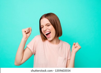 Close up photo beautiful amazing her she lady arm hand palm fists raised up air gladness yelling loudly great achievement successful day week wear casual t-shirt isolated teal turquoise background