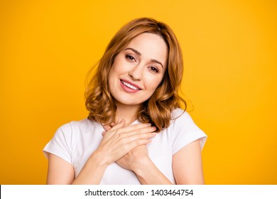 Close up photo beautiful amazing she her foxy lady overjoyed hold arms hands palms breast chest satisfied healthy refreshed fresh grateful wear casual white t-shirt isolated yellow background
