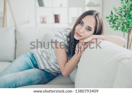 Close up photo beautiful amazing she her lady imaginary inspiration flight calm peaceful kindhearted easy-going wear striped t-shirt jeans denim sit comfort divan bright flat house living indoors