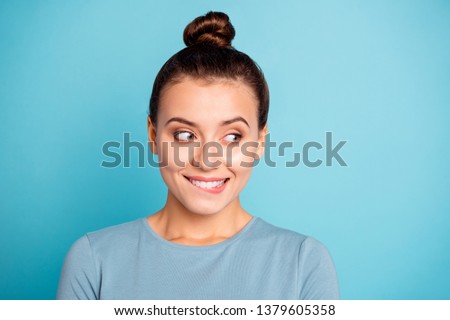 Close up photo beautiful funky amazing she her lady cute look side empty space bite lip give me candies cookies yummy hungry expression wear casual sweater pullover isolated blue bright background