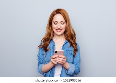 Close up photo beautiful she her lady arm hand telephone smart phone reader look see news check instagram followers stories pictures wear casual blue jeans denim shirt isolated grey background