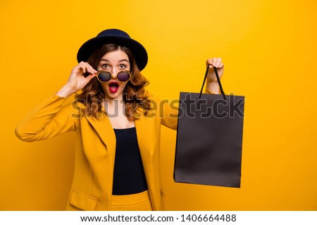 Close up photo beautiful she her lady black friday hold carry packs perfect look buy buyer present gift birthday low prices wear specs formal-wear costume suit isolated yellow bright background