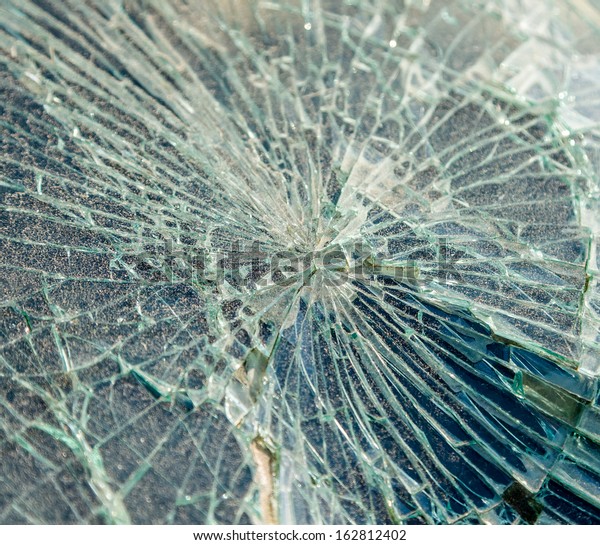 Close up photo of a
broken windshield