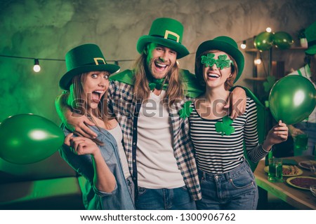 Close up photo buddies gathering company three friends cuddle anniversary tradition guys friends weekend vacation drunk funny funky specs casual outfit clothes saint paddy day festive