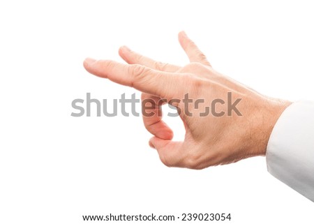 Close up photo of business man hand preparing flick with his index finger isolated on white background