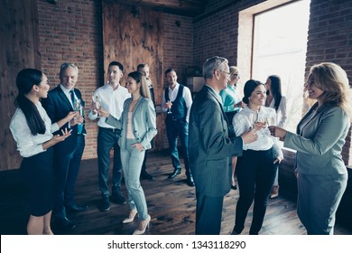 Close up photo business people different age race free leisure excited team building members gathering she her he him his golden beverage toasting best brigade friendship formal wear jackets shirts - Powered by Shutterstock