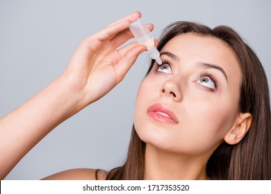 Close Up Photo Of Charming Girl Want Cure Her Myopia Refresh Eye Use Eye Dropper Isolated Over Gray Color Background
