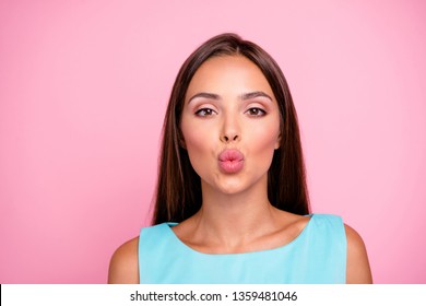 Close up photo of charming good-looking lady sending air kisses to guys boyfriends feeling affection wearing colorful outfit isolated on rose-colored background