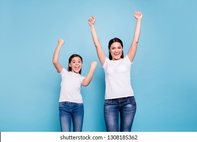 Close Up Photo Cheer Two People Brown Haired Mum Small Little Daughter  Hands Arms High In Air Glad Yelling Free Sale Discount Shopping Buy Buyer Wear White T-shirts Isolated Bright Blue Background