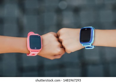 Close Up Photo. Child Using Smartwatch, Wearable Children Tracking Gadget With Touch Screen And Voice Service, Electronic Wristband For Children