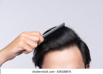 Close Up Photo Of Clean Healthy Man's Hair. Young Man Comb His Hair