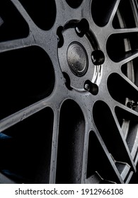 Up Close Photo Of Custom Car Rim With Water Droplets