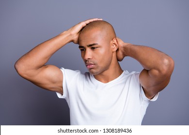 Close Up Photo Dark Skin He Him His Guy Hand Arm Hold Bald Head Looking Pensive Contemplation Concentrated Guessing To Empty Space Wearing White T-shirt Outfit Clothes Isolated On Grey Background