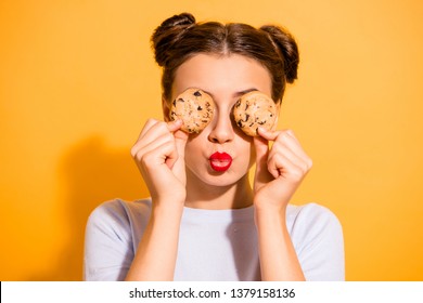 Close up photo of dreamy charming little lady cooking pastry sugar dishes fooling around in the kitchen following diet wearing light woolen pullover isolated on bright background