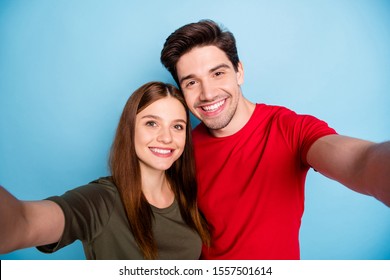 Close up photo of dreamy passionate two married people students relax rest hug embrace make selfie on summer journey wear green red t-shirt isolated over pastel color background - Powered by Shutterstock