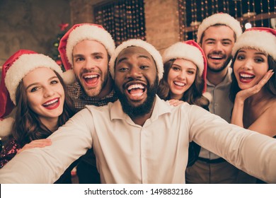 Close up photo of excited mutliethnic youth  enjoy christmas holidays x-mas party make selfie in house indoors - Powered by Shutterstock