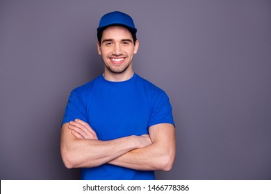 Close up photo express specialist he him his delivery boy strong arms crossed beaming smile self-confident person order offer customer wear blue t-shirt cap corporate suit isolated grey background