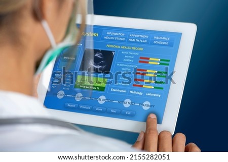 Close up photo of female doctor working on electronic medical record to check patient information.