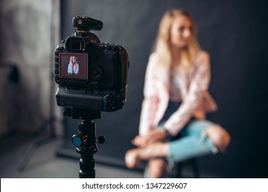 close up photo, focus on a working digital camera at the studio, blurred background - Powered by Shutterstock