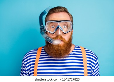 Close Up Photo Of Funky Shocked Red Hair Man Watersport Lover Breathe Diving Tube Have Mask Wear Nautical Vest Orange Suspenders Isolated Over Blue Color Background