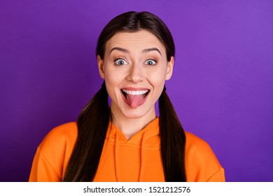 Close Up Photo Of Funny Funky Cheerful Teen Girl With Her Tongue-out Want Be Real Comedian Have Free Time Weekends Wear Sportive Wear Isolated Over Purple Violet Color Background