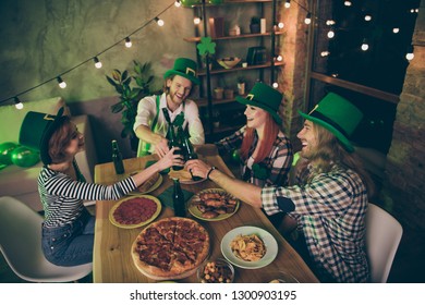 Close Up Photo Gathered Big Table Company Four Friends Couples Pairs Love Lovers Tasty Drinks Green Hats Leaf Pizza Sausage Chips Irish Culture Home Party Leprechaun Costumes