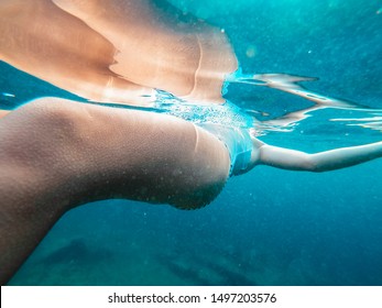 Close Up Photo Of Girl Floating In The Cold Water With Goosebumps On Her Skin