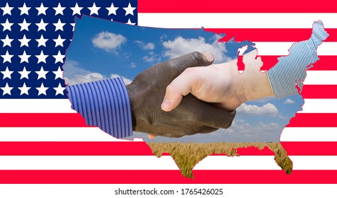 Close Up Photo Of A Handshake Between Afroamerican And European Hands Inside Of US Map Silouette. Handshake Is In Front Of US Flag.