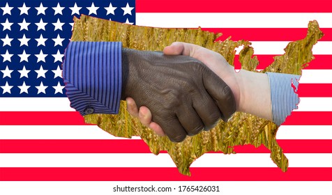 Close Up Photo Of A Handshake Between Afroamerican And European Hands Inside Of US Map Silouette. Handshake Is In Front Of US Flag.