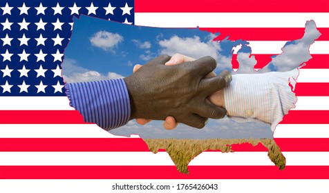 Close Up Photo Of A Handshake Between Afroamerican And European Hands Inside Of US Map Silouette. Handshake Is In Front Of US Flag.