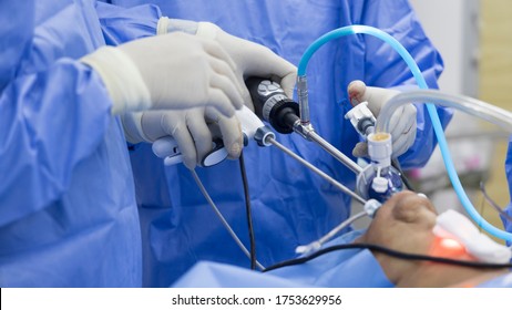 Close up photo of Keyhole surgery.Transoral endoscopic thyroidectomy was perform in modern operating room. Surgeon doctor doing advance surgery with camera. Selective focus and shallow DOF.