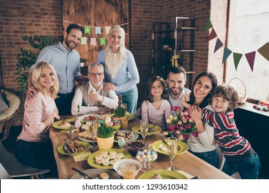 Close Up Photo Of Large Company Gathered Family Holiday Sitting With Flowers Tulips Champagne Hugs Toothy Smiles Easter Eggs Gladness Decorations Weekend Vacation