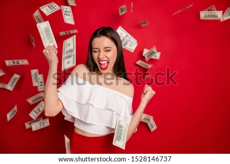 Close up photo of lovely  youth with closed eyes raising fists screaming yeah isolated over red background with windfalling savings