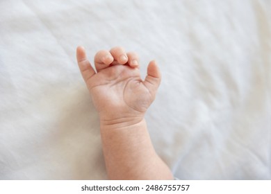 Close up photo of a newborn baby's hand - Powered by Shutterstock