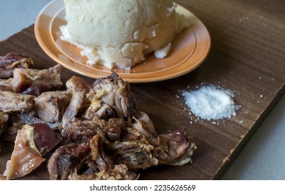 Close up photo of nyama choma-Grilled goat meat- and Ugali - corn meal. A popular dish in East Africa, particularly Kenya and Tanzania, where it's regarded as national dish. Selective focus.  - Shutterstock ID 2235626569