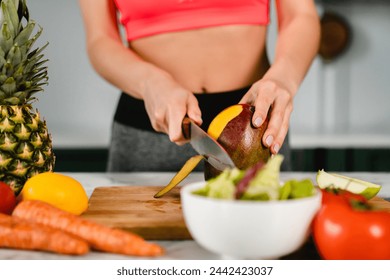 Close up photo of peeling mango on cutting board with healthy vegetables and fruits. Slimming and losing weight. Control over calories and fiber in ration concept - Powered by Shutterstock