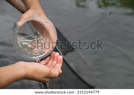 Close up photo of a plastic drink cup used by a child to play in the water.  simple but fun.