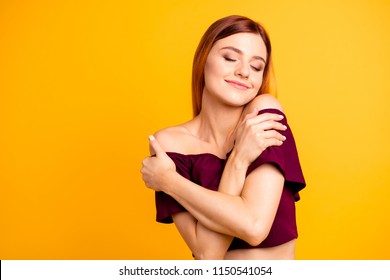 Close up photo portrait of attractive person lady with satisfied emotion facial expression hugging herself wearing maroon colorful clothing isolated on bright background copyspace - Shutterstock ID 1150541054