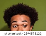 Close up photo portrait of handsome young guy eyes look down empty space isolated on khaki color background